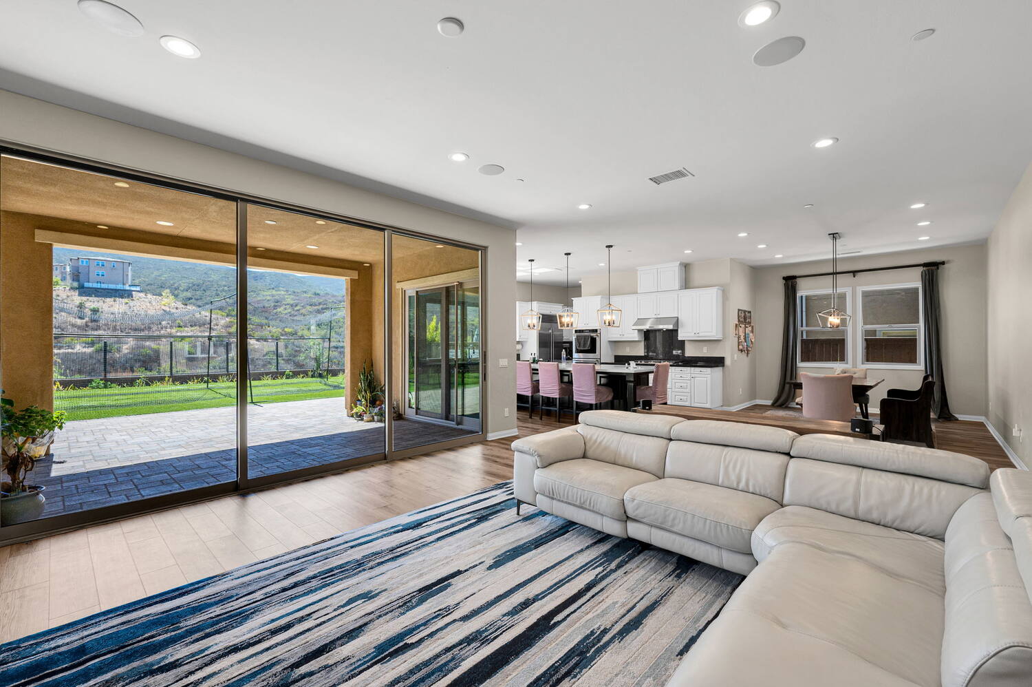 Great room, sliders open to the covered patio