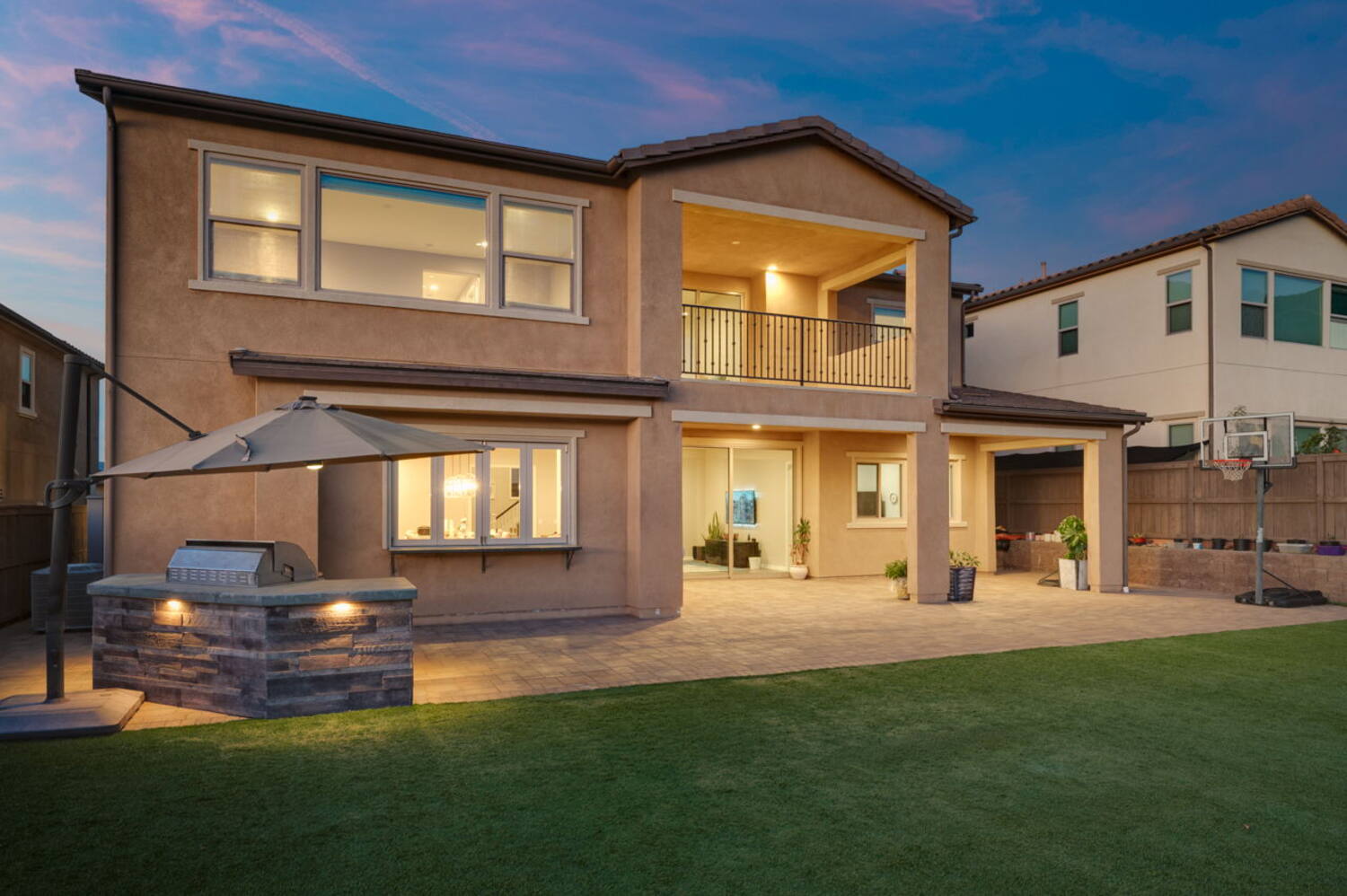 Rear elevation and patio at twilight