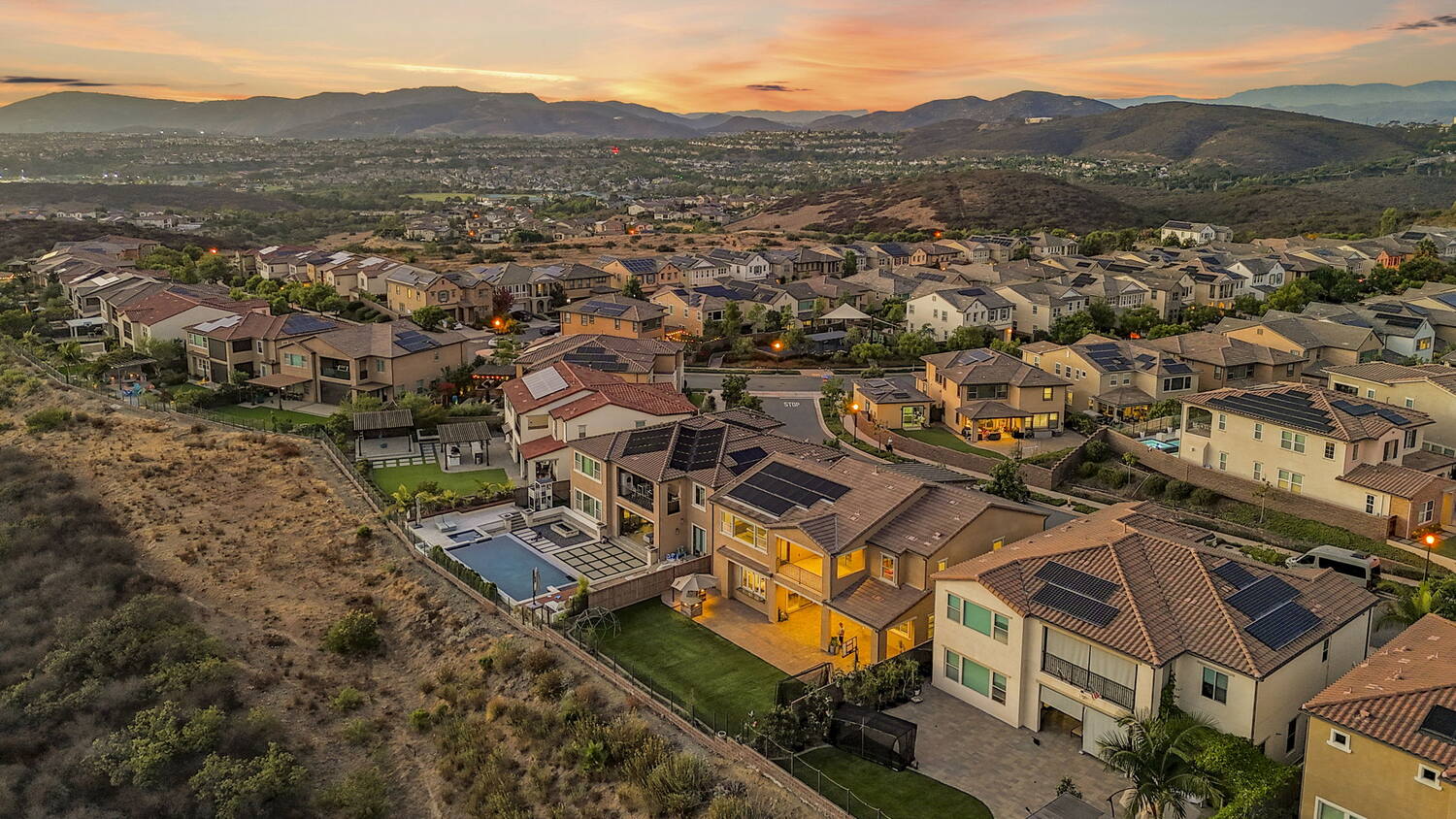 The ridge at dusk. Open land begins at the property line